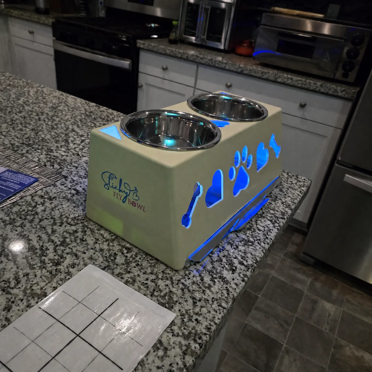 Illuminated cream Sticky Fly Bowl on a kitchen counter with the power cord removed